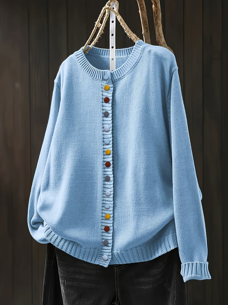 Back view of a women's relaxed-fit cardigan in cream showing sleeve and shoulder length