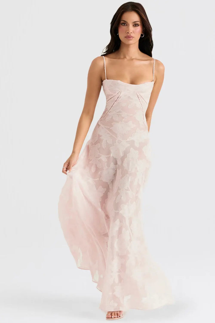 Detail shot of the draped open back on a long flowy summer dress in pink