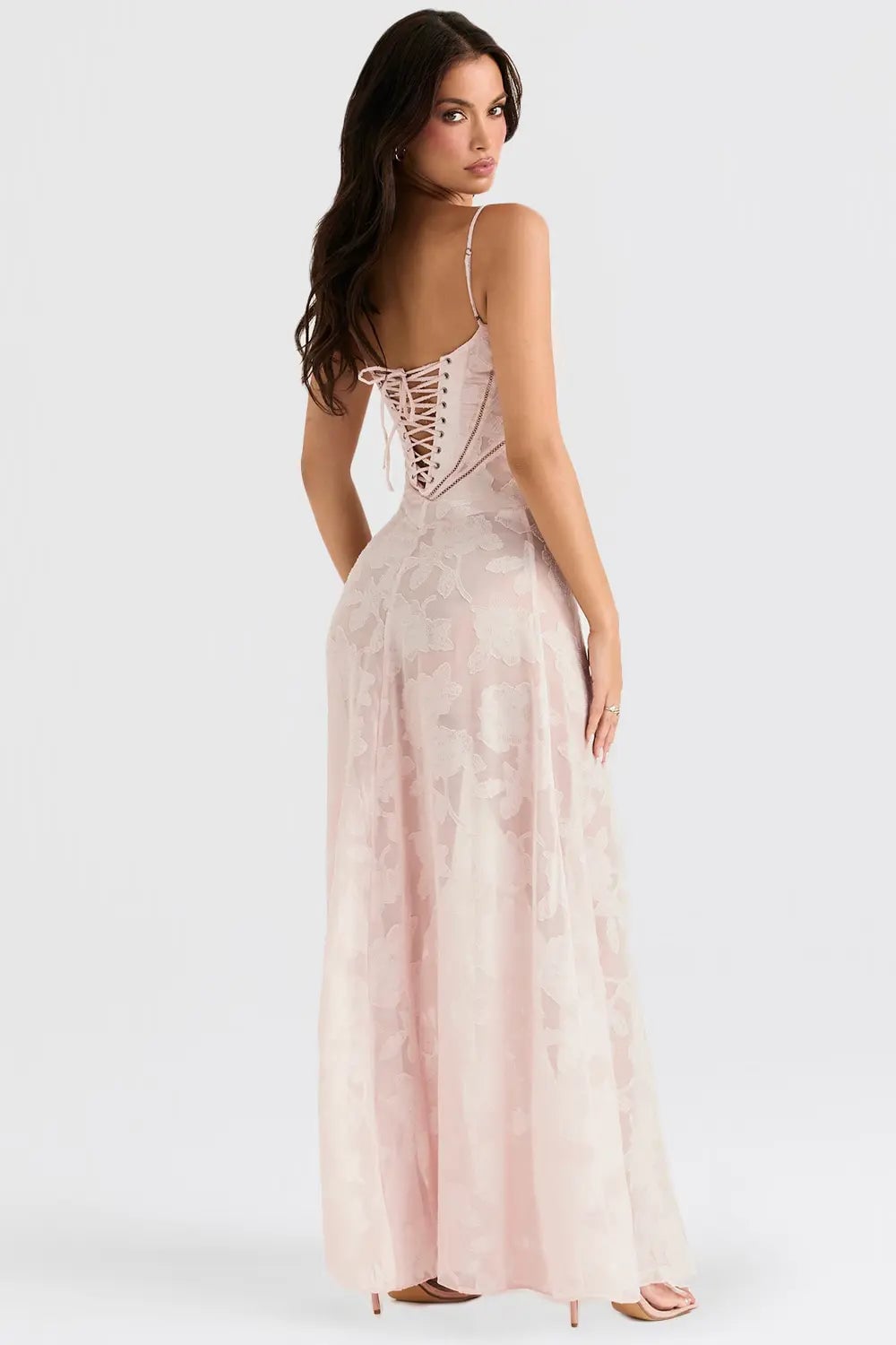 Close-up of the flowing hem of a long black summer dress, lightweight fabric in motion