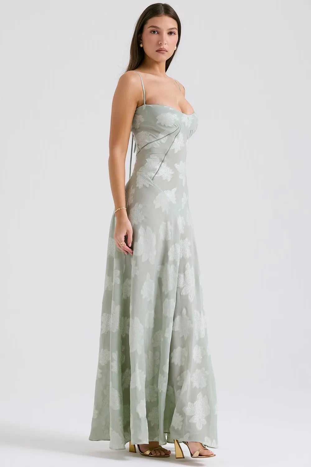 Detail of the spaghetti strap and open back on a long purple summer dress