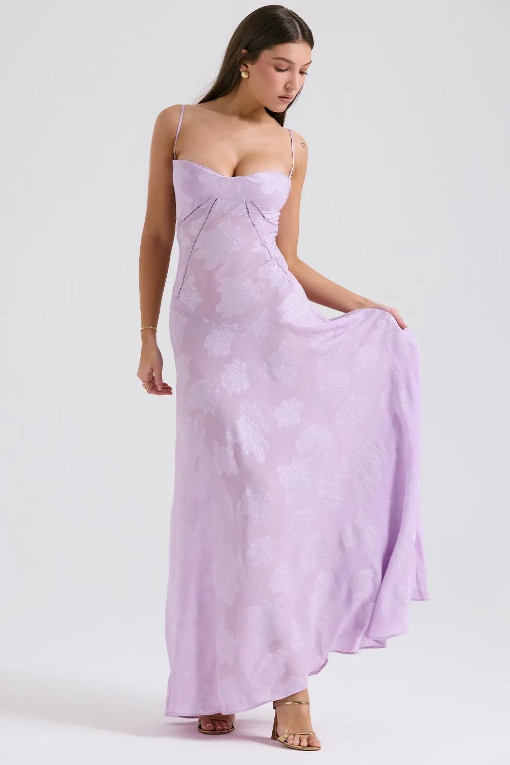 Full-body view of a long purple summer dress with open back, showing the hem sweep