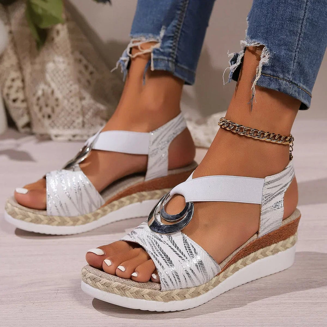 Grove sandals in white displayed on a neutral surface