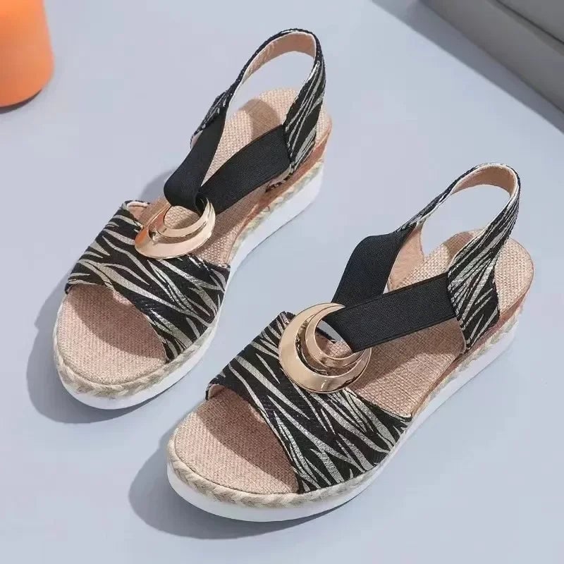 Grove sandals in all four colors — gray, black, beige, and white — displayed together