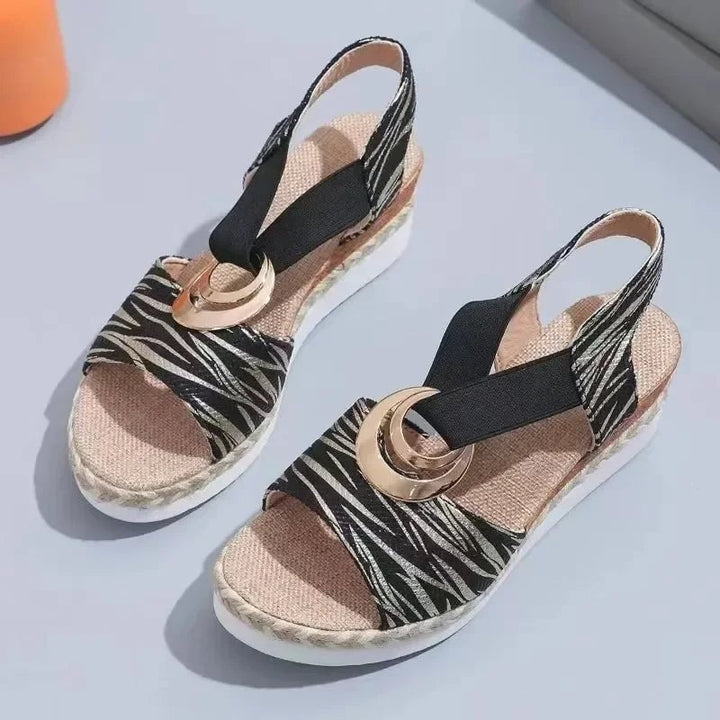Grove sandals in all four colors — gray, black, beige, and white — displayed together