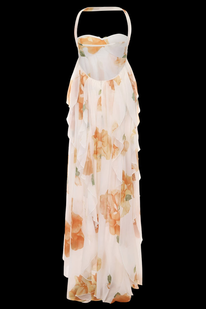 Model in an elegant halter maxi dress styled for a summer occasion
