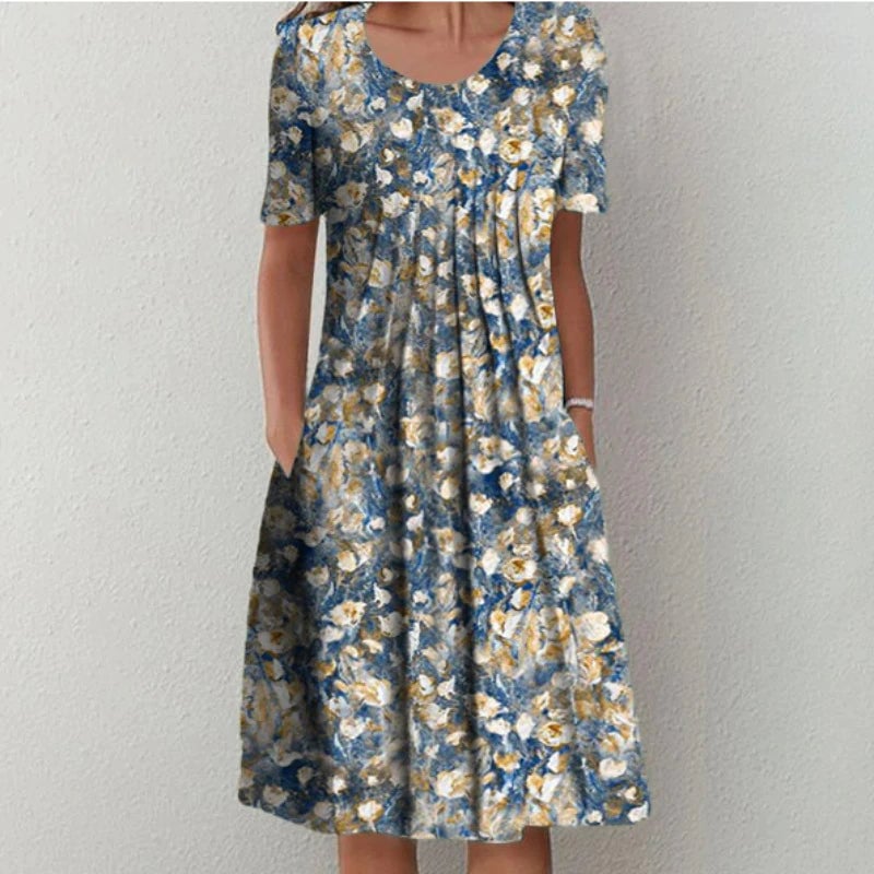 Model in a yellow floral dress showing the flattering silhouette and free-moving skirt