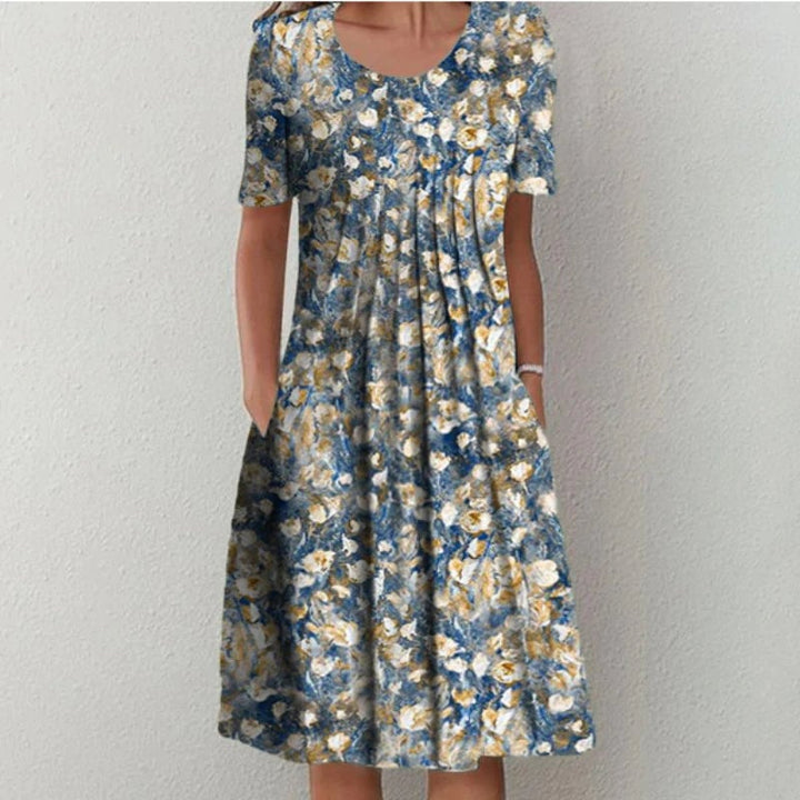Model in a yellow floral dress showing the flattering silhouette and free-moving skirt