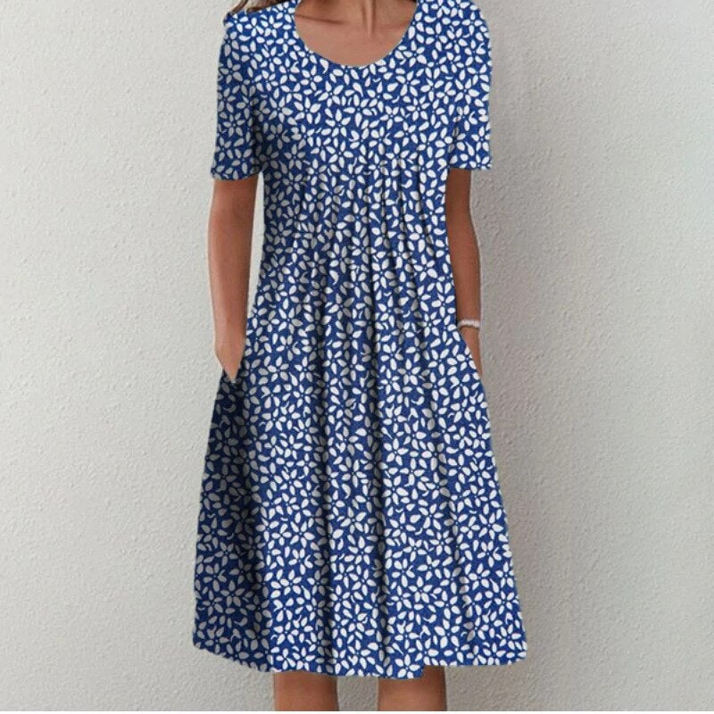 Front view of the light blue floral dress with short sleeves, available in sizes S to 3XL