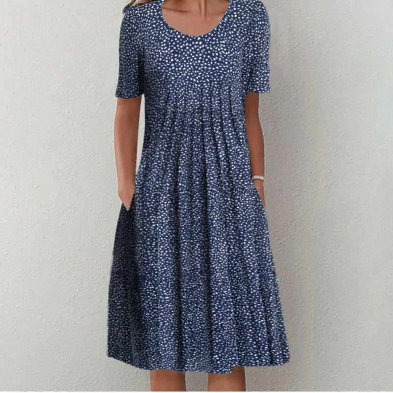Side view of the blue floral dress highlighting the convenient side pocket detail