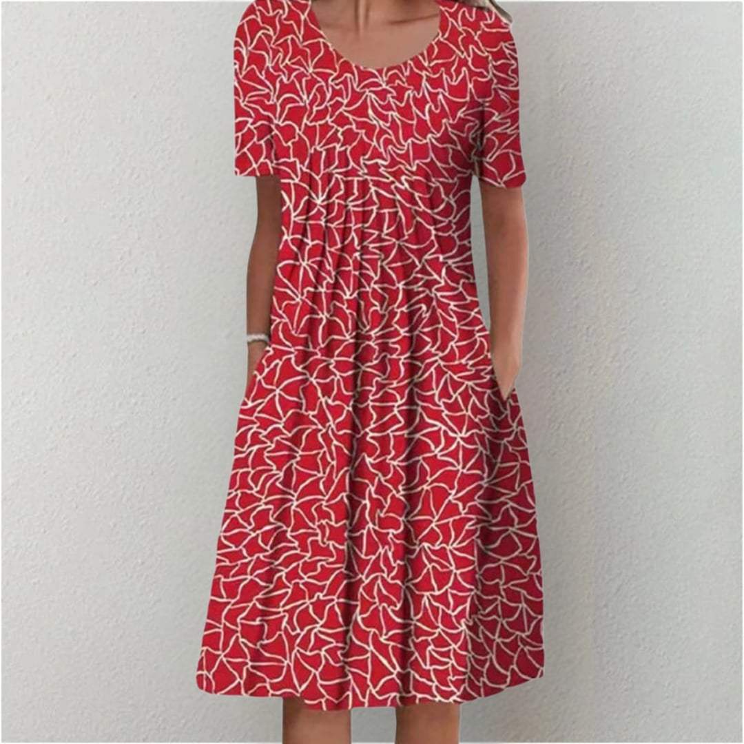 Woman in a polka dot dress styled with sandals for a casual summer outing