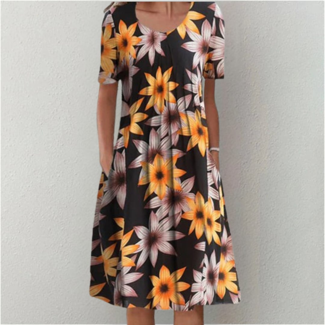 Model wearing the blue-white print dress, perfect for brunch or outdoor events