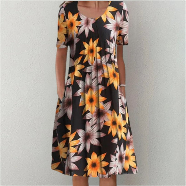 Model wearing the blue-white print dress, perfect for brunch or outdoor events