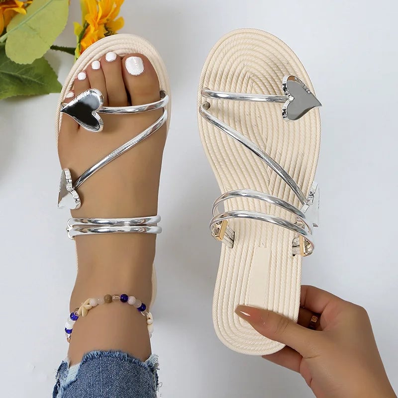Gwendolyn women's rhinestone sandals in silver with shimmering stone embellishments on a white background