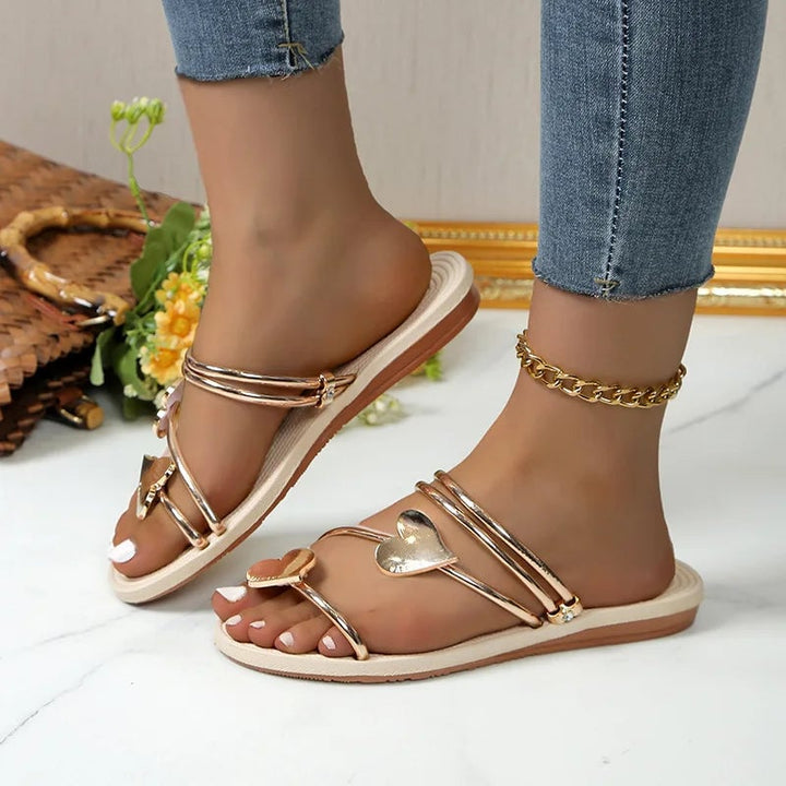 Close-up of Gwendolyn rhinestone sandal straps in silver showing detailed sparkle and secure buckle