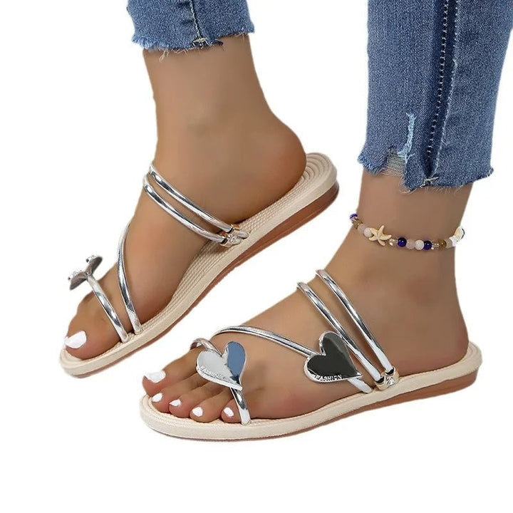 Flat lay of Gwendolyn rhinestone sandals in both silver and gold colorways side by side