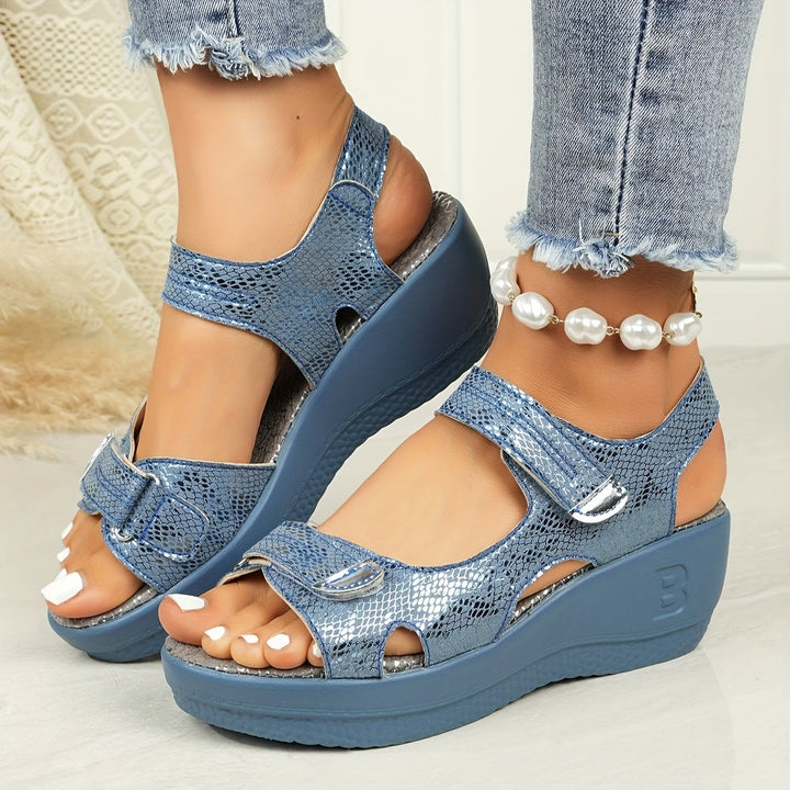Hadley sky blue wedge sandals worn with light-wash denim cutoffs outdoors