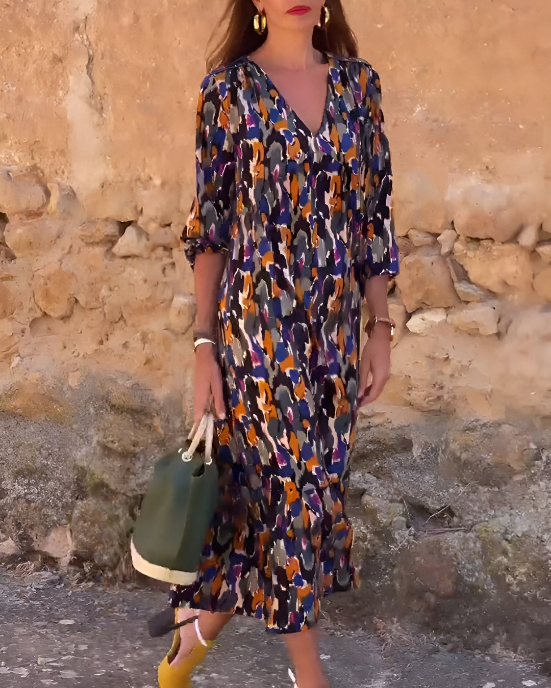 Close-up of the Hadley dress V-neckline and bold retro-inspired print detail