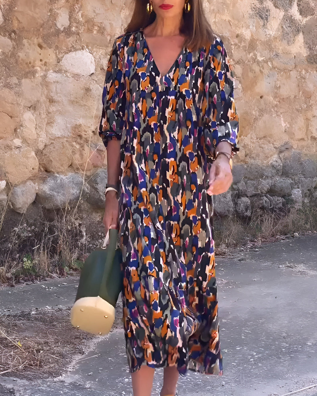 Full-length back view of the Hadley V-neck printed dress in multicolor, showing graceful flowing skirt
