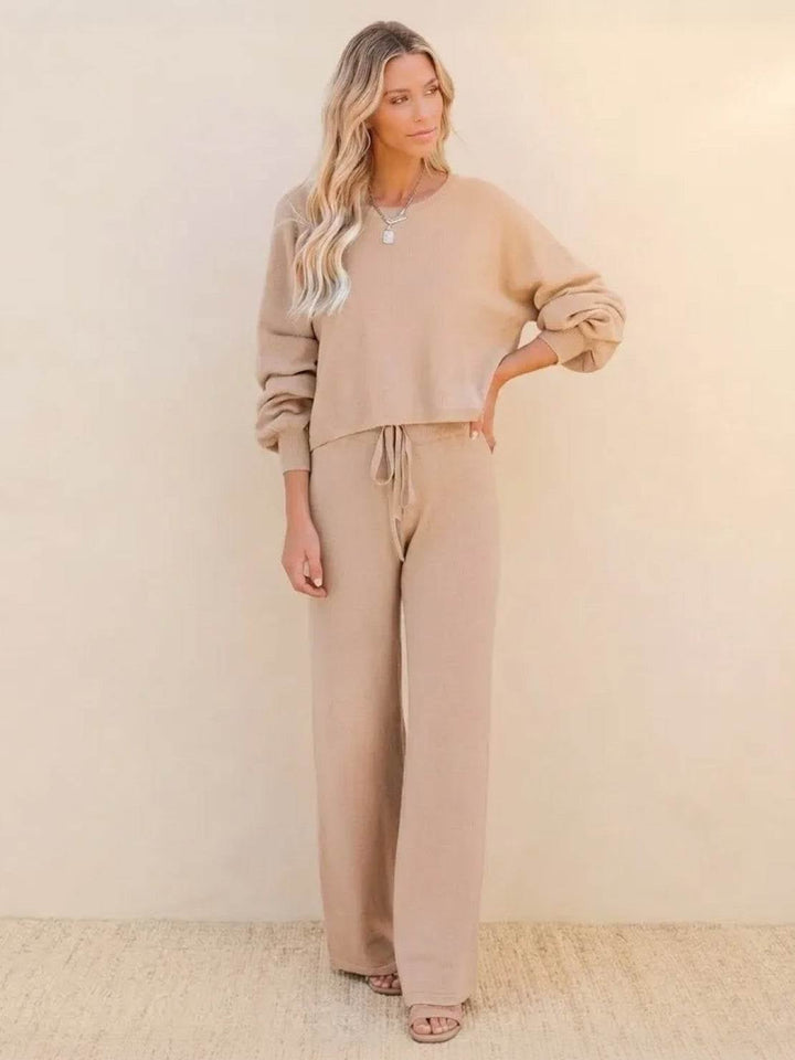 Woman wearing the Hailey cropped crew-neck sweatshirt and wide-leg drawstring pants lounge set in apricot