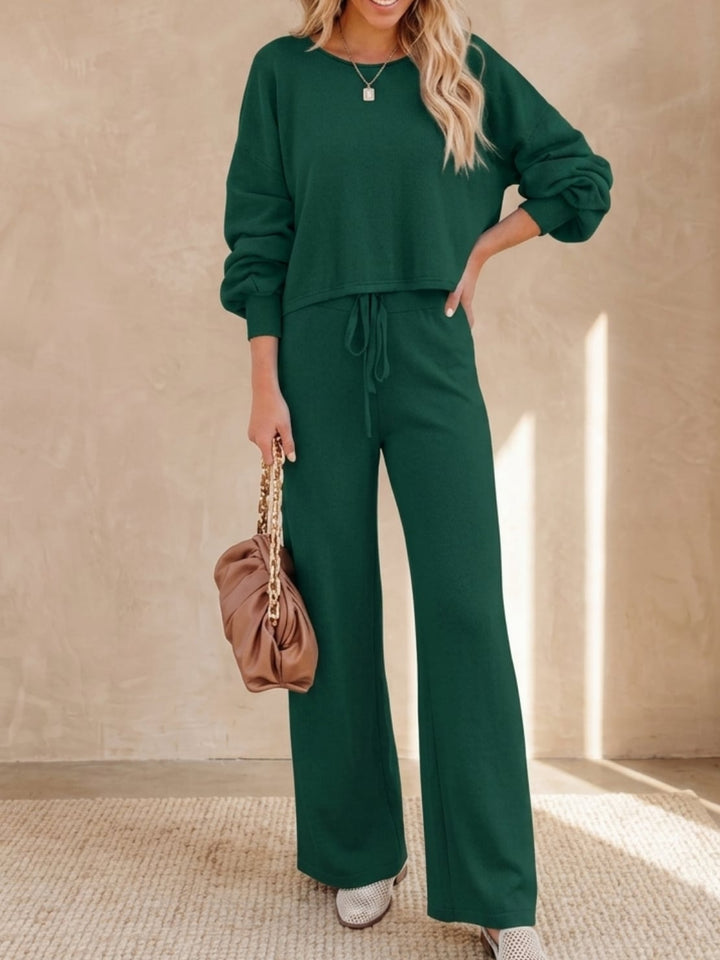 Woman wearing the Hailey lounge set in khaki styled with white sneakers