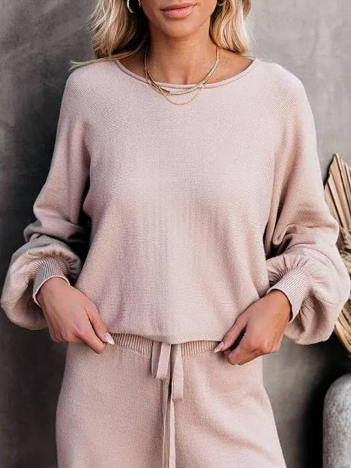 Woman wearing the Hailey cropped sweatshirt and wide-leg pants lounge set in black