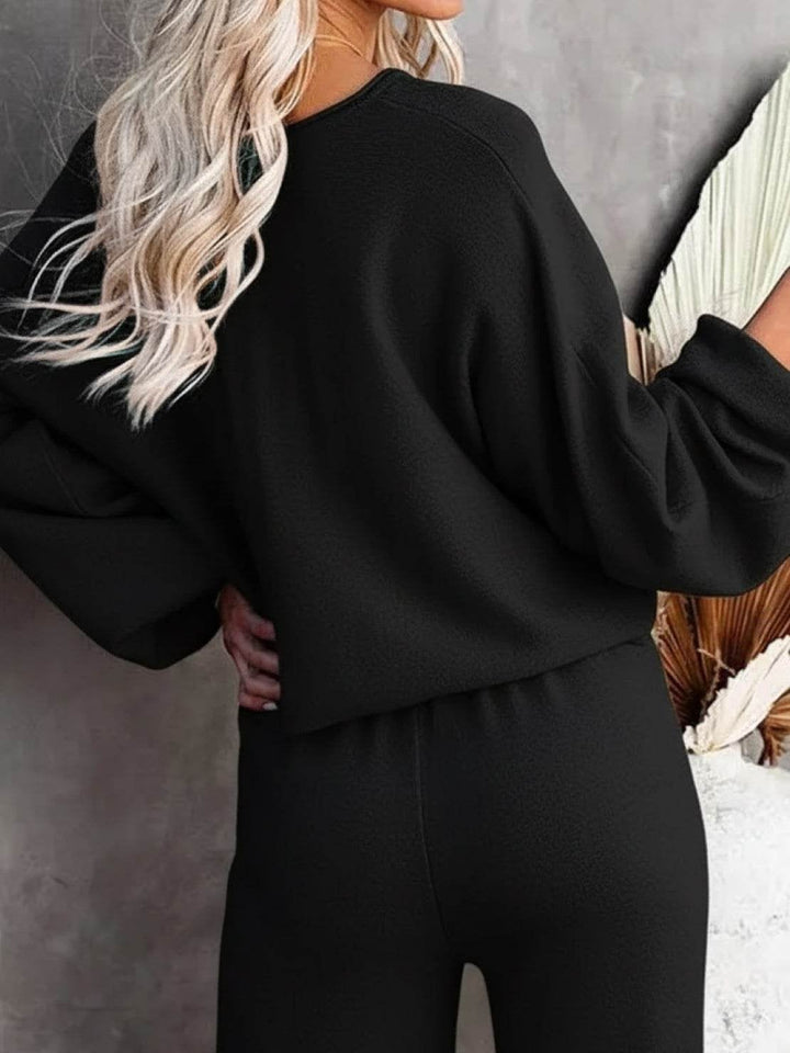 Side view of the Hailey wide-leg lounge pants and cropped sweatshirt in navy blue