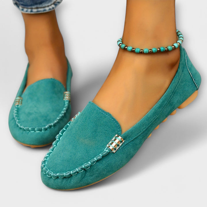 Haley moccasin slip-on in black colorway shown from the side