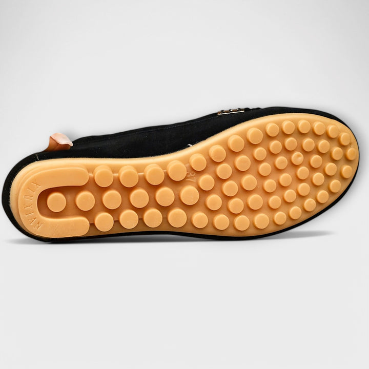 Flat lay of multiple Haley moccasin slip-on color options arranged together