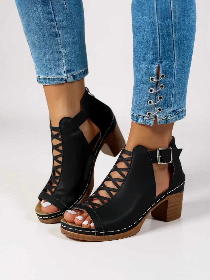 Halle women's cushioned criss-cross sandals in black, front view on a clean background