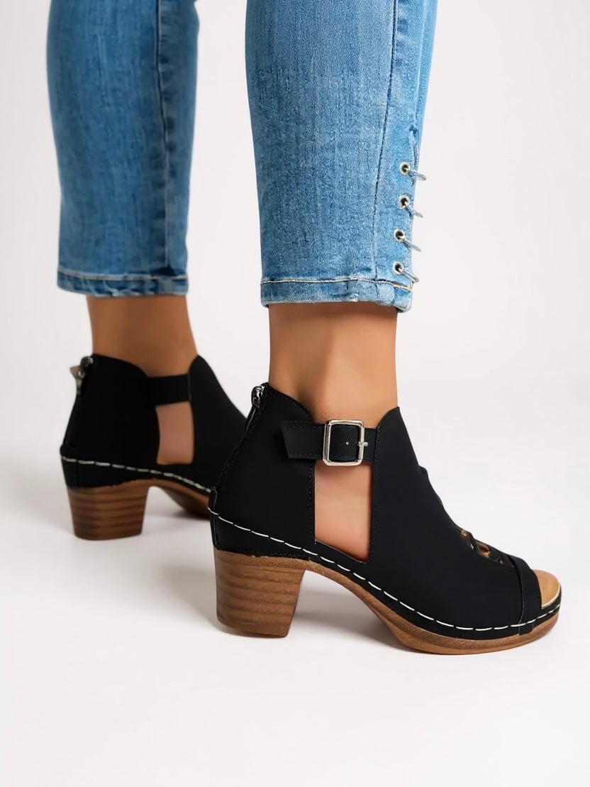 Side profile of Halle women's sandals in black highlighting the lightweight flexible sole