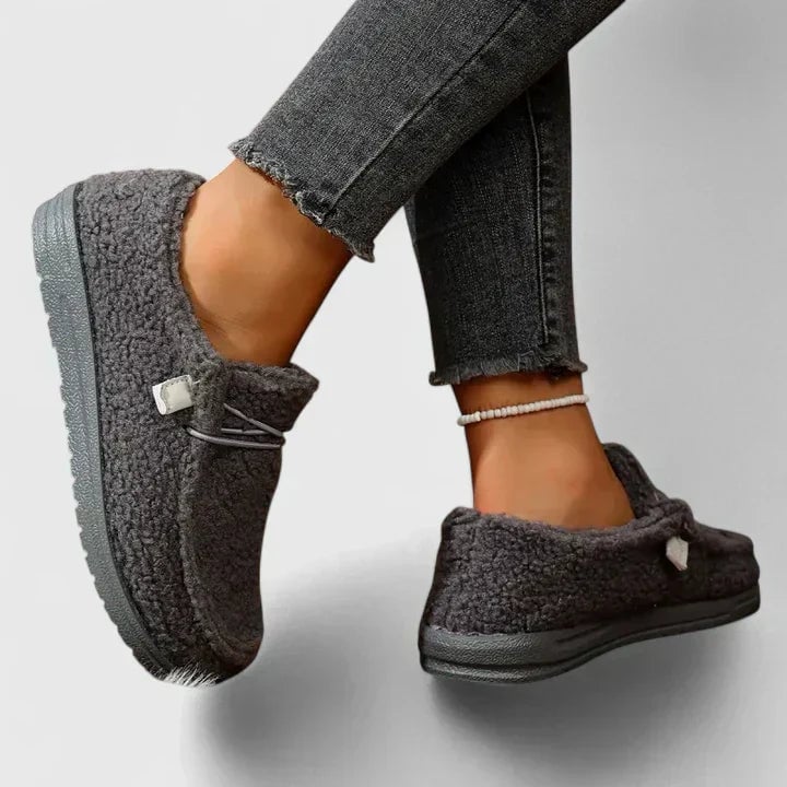 Hana orthopedic loafers in black shown from a side profile angle emphasizing the sleek silhouette