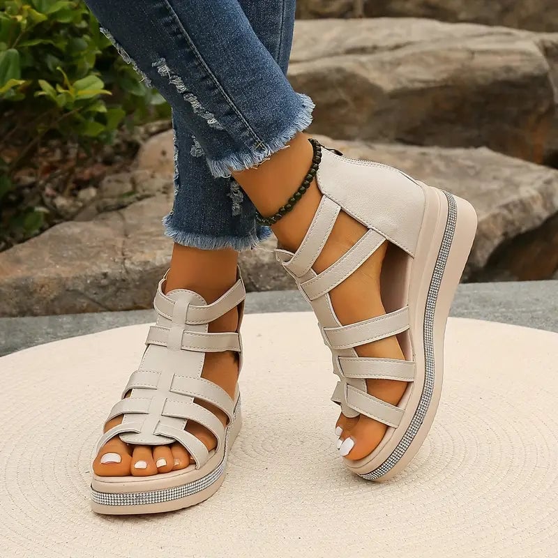 Hannah black sandal close-up showing cushioned footbed and adjustable buckle strap