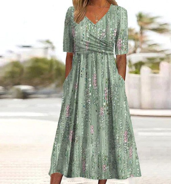 Model wearing a green floral A-line midi dress with a flattering silhouette, perfect for warm summer days