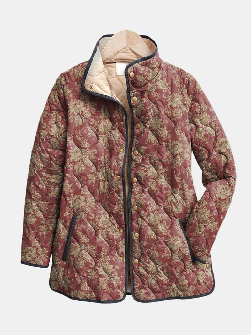 Woman wearing a dark pink retro floral print quilted jacket with a relaxed, flattering fit