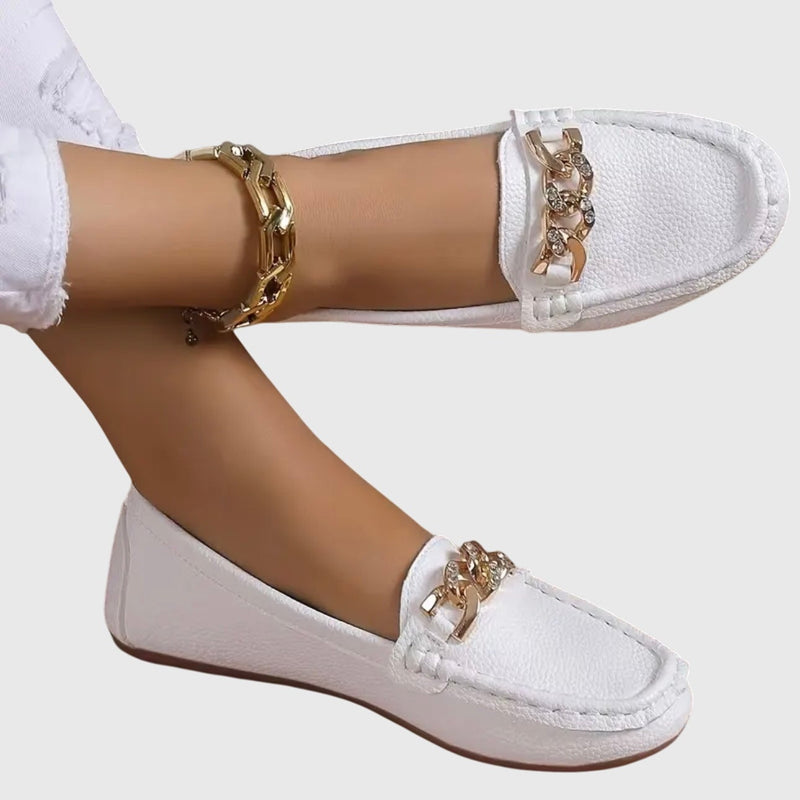 Harlow slip-on flat loafers in white with chunky gold chain hardware detail across the vamp
