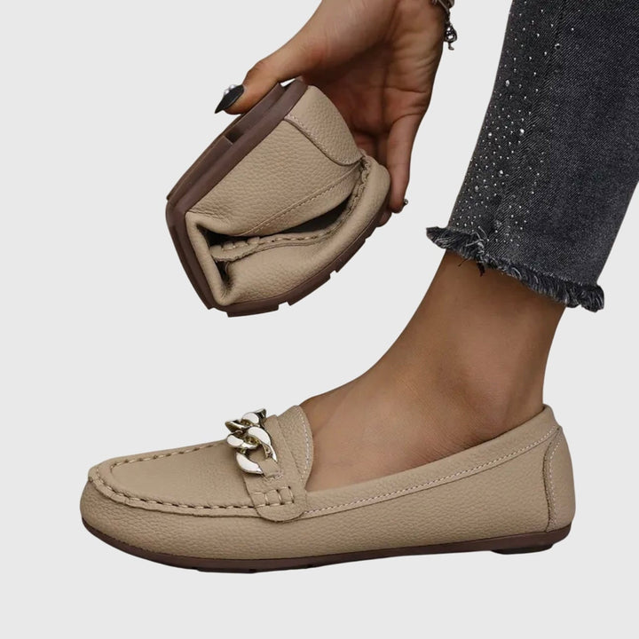 Harlow loafers in black with gold chain detail, side profile view