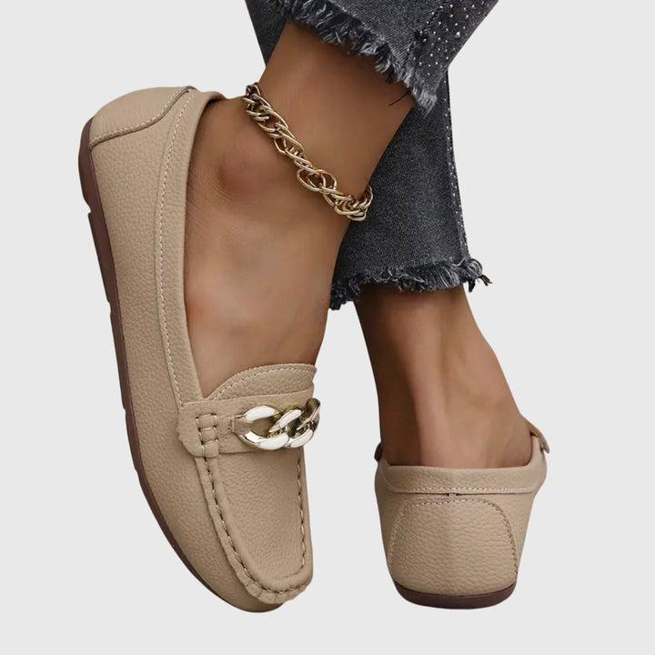 Harlow black loafers showing pebbled texture upper and moccasin stitching detail