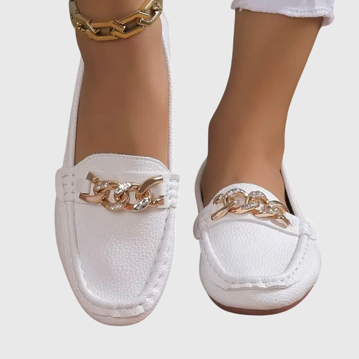Close-up of moccasin topstitching on Harlow beige flat loafers
