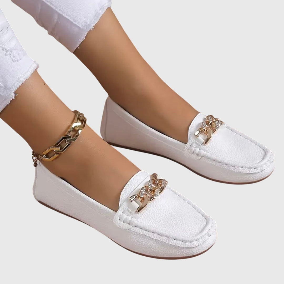 Harlow beige chain loafers styled with casual outfit, front three-quarter view