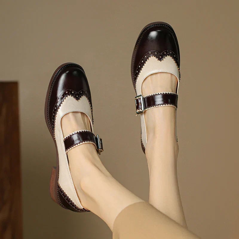 Harlow mary jane shoes in brown two-tone colorway with brogue detailing, front three-quarter view