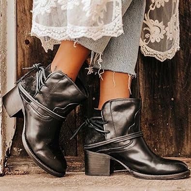 Harlow western block heel booties in black showing wraparound lace-up detail, side view