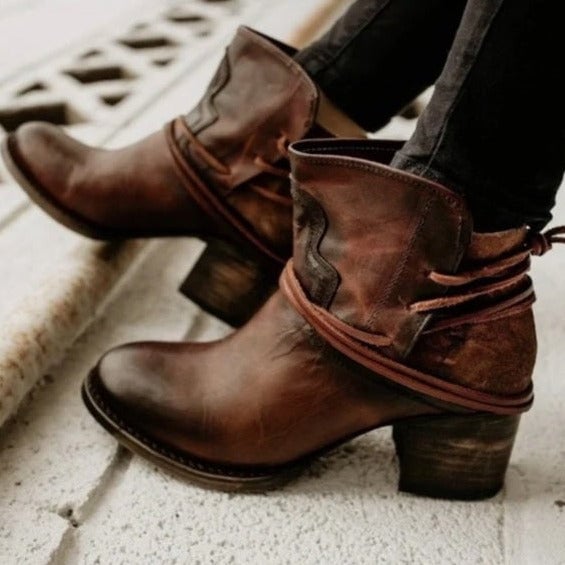 Harlow ankle booties in cognac brown with lace-up wrap and stacked heel, three-quarter view