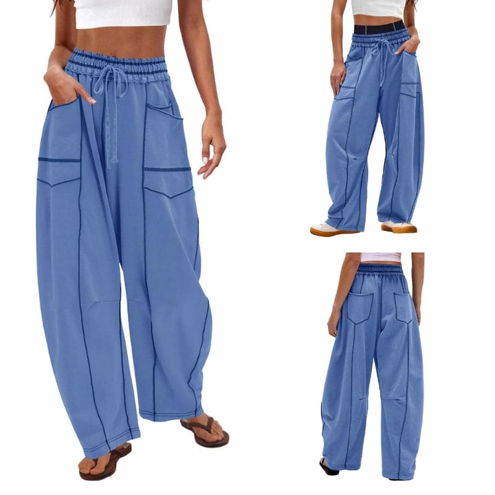Model wearing Harlow wide leg cargo pants in light gray with an oversized tee
