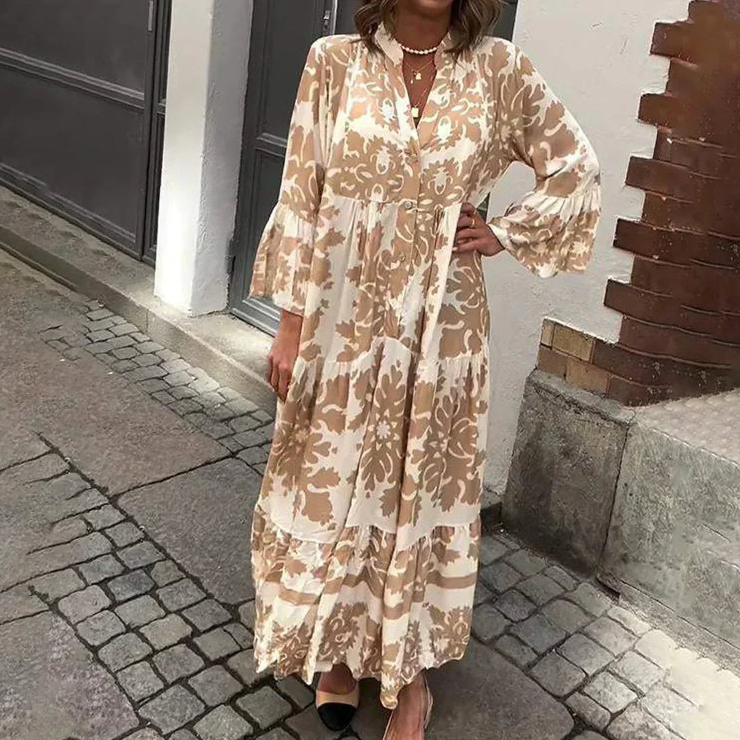Woman wearing the Harmony boho flowy printed draped maxi dress in a relaxed outdoor setting