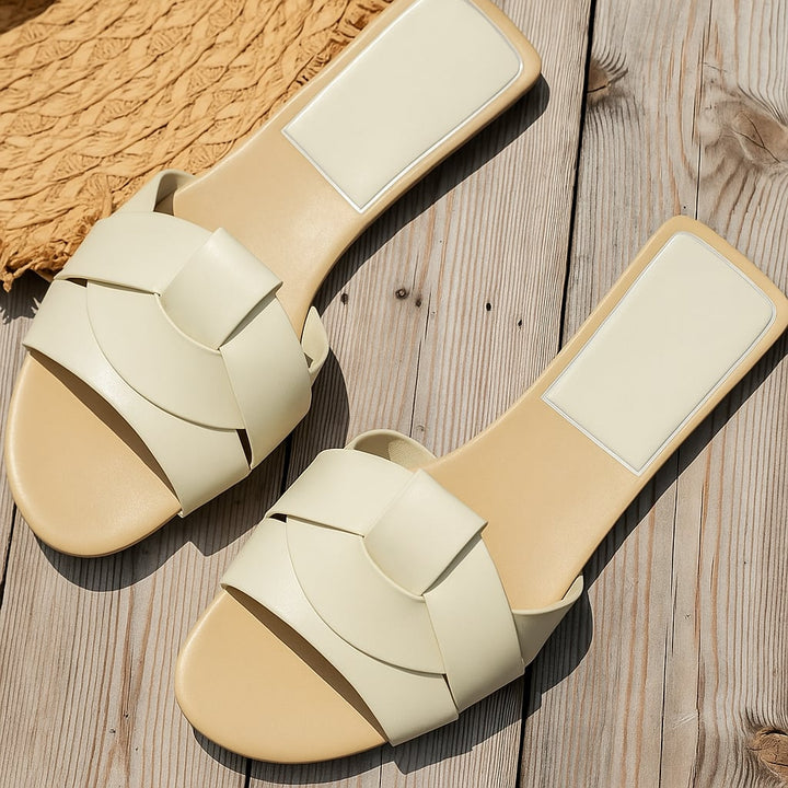 Harper women's slides in brown displayed at an angle to show outsole texture