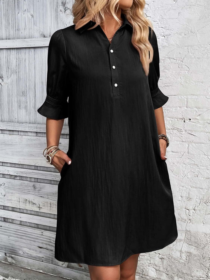 Front view of the Harper button-down shirt dress in black with spread collar and ruffle flared cuffs