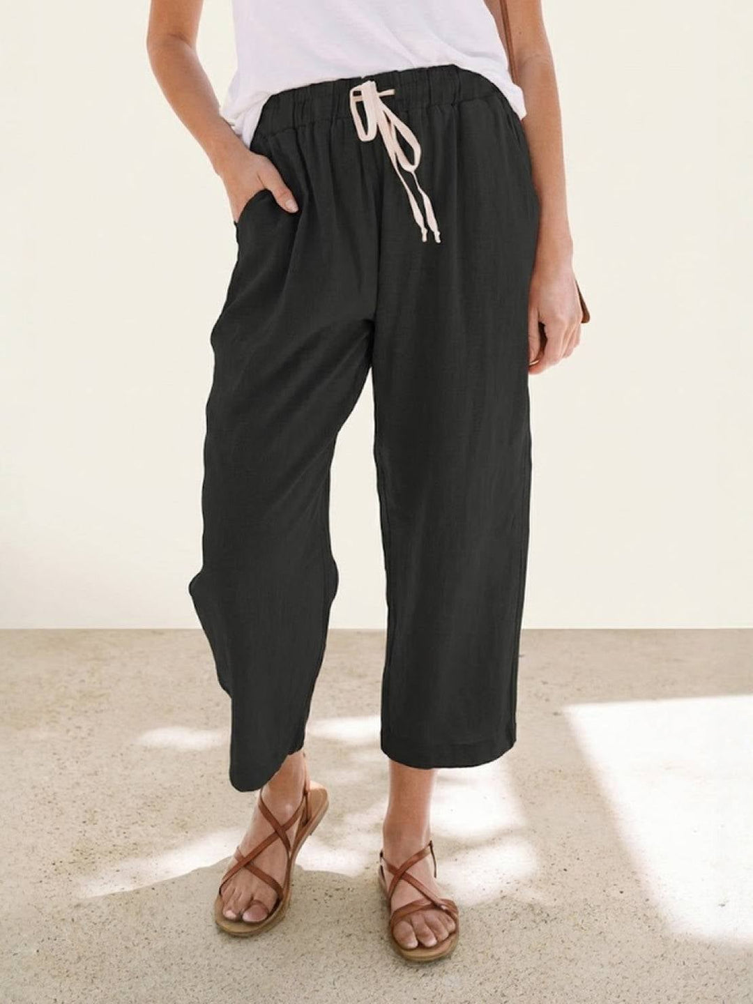 Back view of Harper casual straight-leg pants in apricot showing relaxed fit