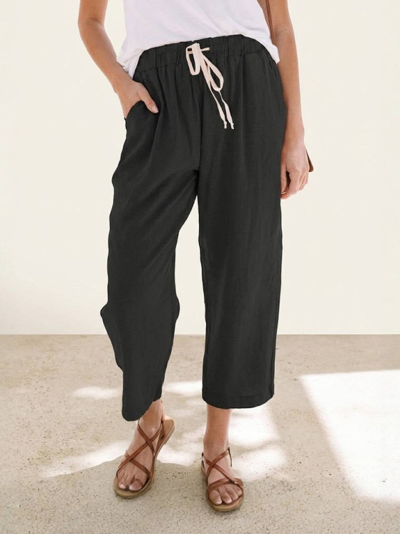 Back view of Harper casual straight-leg pants in apricot showing relaxed fit