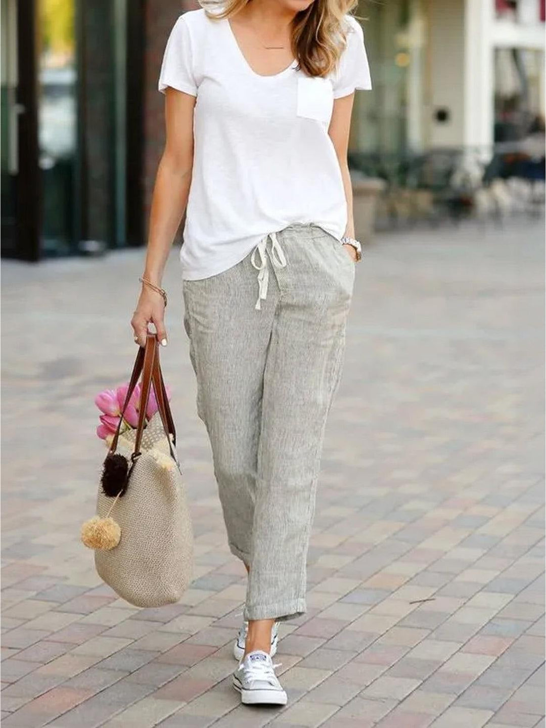 Side view of Harper drawstring pants in black with linen-look fabric detail