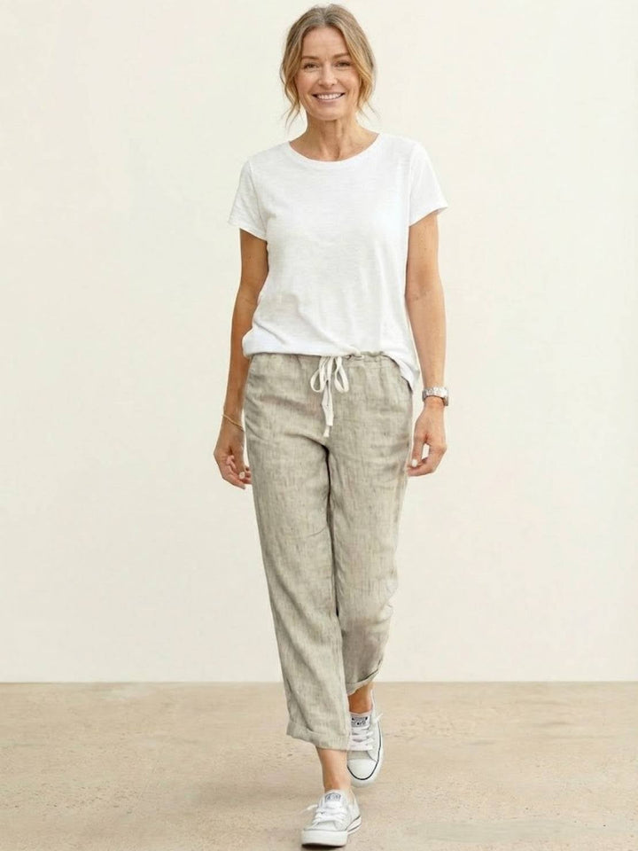 Close-up of drawstring waistband on Harper pants in black